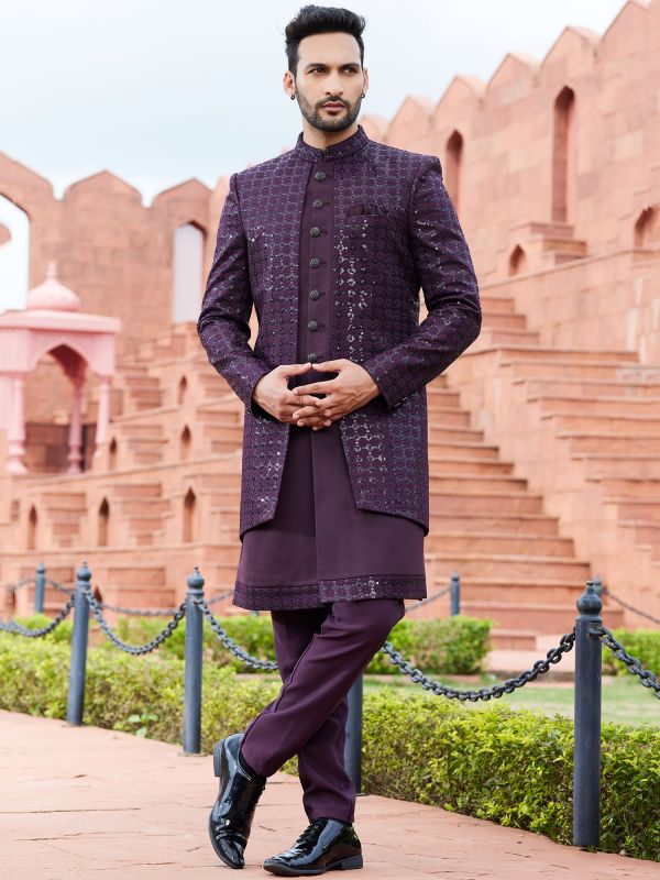 Royalty-free stock photo of a cute Indian baby boy posing in a Sherwani  with a bar of chocolate - Photos Nepal