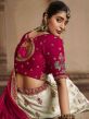 White Embroidered Wedding Wear Lehenga In Rayon