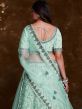 Turquoise Stone Embroidered Lehenga Choli In Net