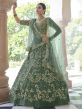 Rama Green Colour Net Fabric Engagement Lehenga Choli.