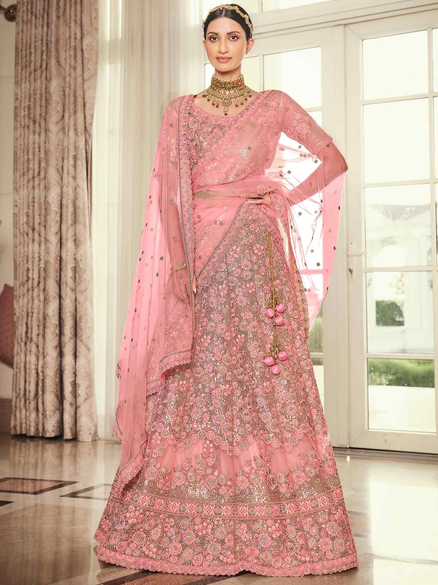Dazzling Peach Colored Partywear Embroidered Silk Lehenga Choli
