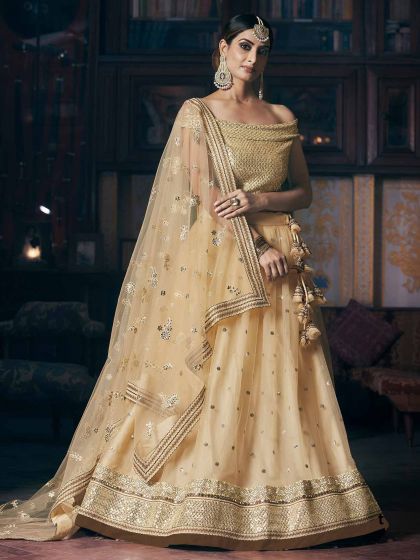 Cream Colour Net Designer Lehenga Choli.