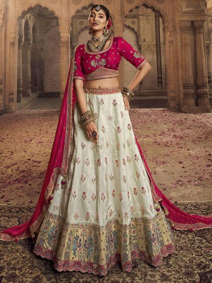 White Embroidered Wedding Wear Lehenga In Rayon