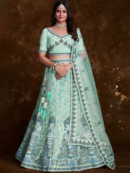 Turquoise Stone Embroidered Lehenga Choli In Net