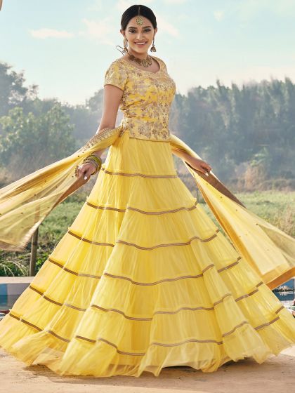 Yellow Panelled Festive Lehenga Set In Net